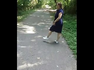 Uber-cute Woman With Ponytails Flashing In The Park